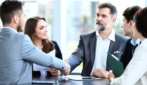 Business people shaking hands, finishing up a meeting